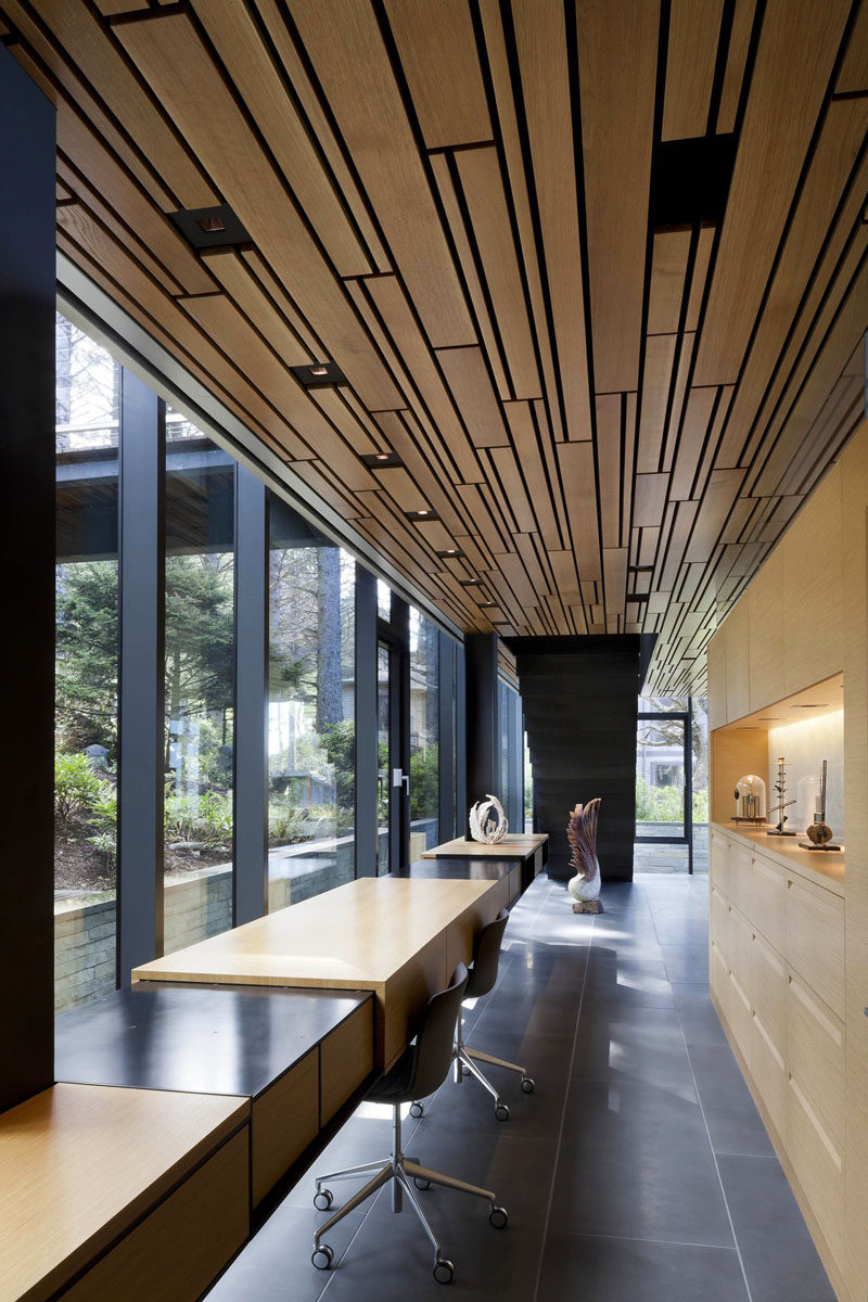 Interior Design Idea - 13 Examples Of Desks In Hallways // These desks on the main level of the home get tons of natural light from the massive windows they have in front of them.