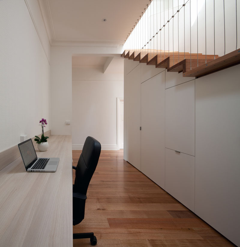 Interior Design Idea - 13 Examples Of Desks In Hallways // This long hallway desk provides a convenient spot to take a break from family life and get some work done.