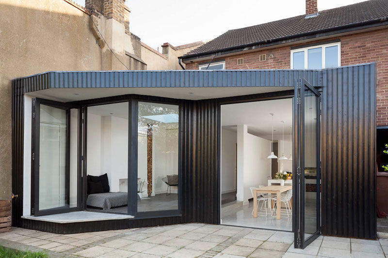 14 Examples Of British Houses With Contemporary Extensions // This London home got a minimalist extension that increased the amount of functional living space and added a modern feel to the brick house.