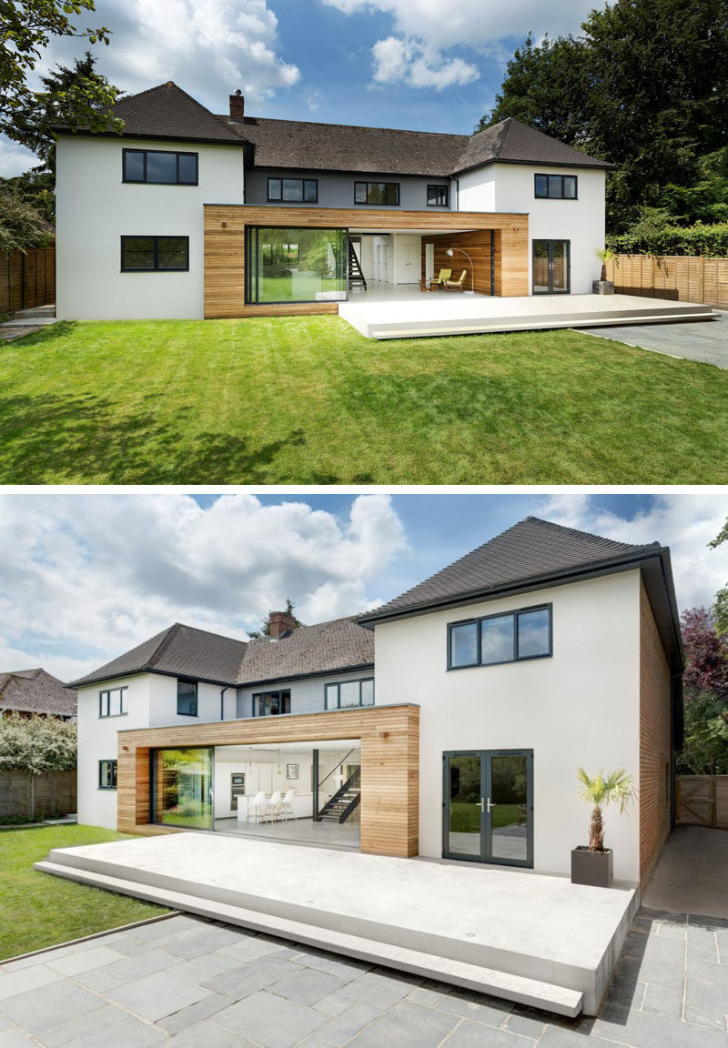 14 Examples Of British Houses With Contemporary Extensions // Light wood paneling and a sliding glass door that runs the length of the extension brightens up this British home, and connects the lower level to the large backyard.