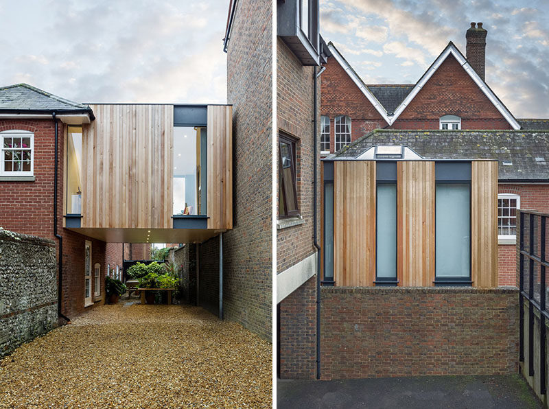 14 Examples Of British Houses With Contemporary Extensions // A floating wood clad box extension on this brick British home created more living space and a covered parking area on the side of house.