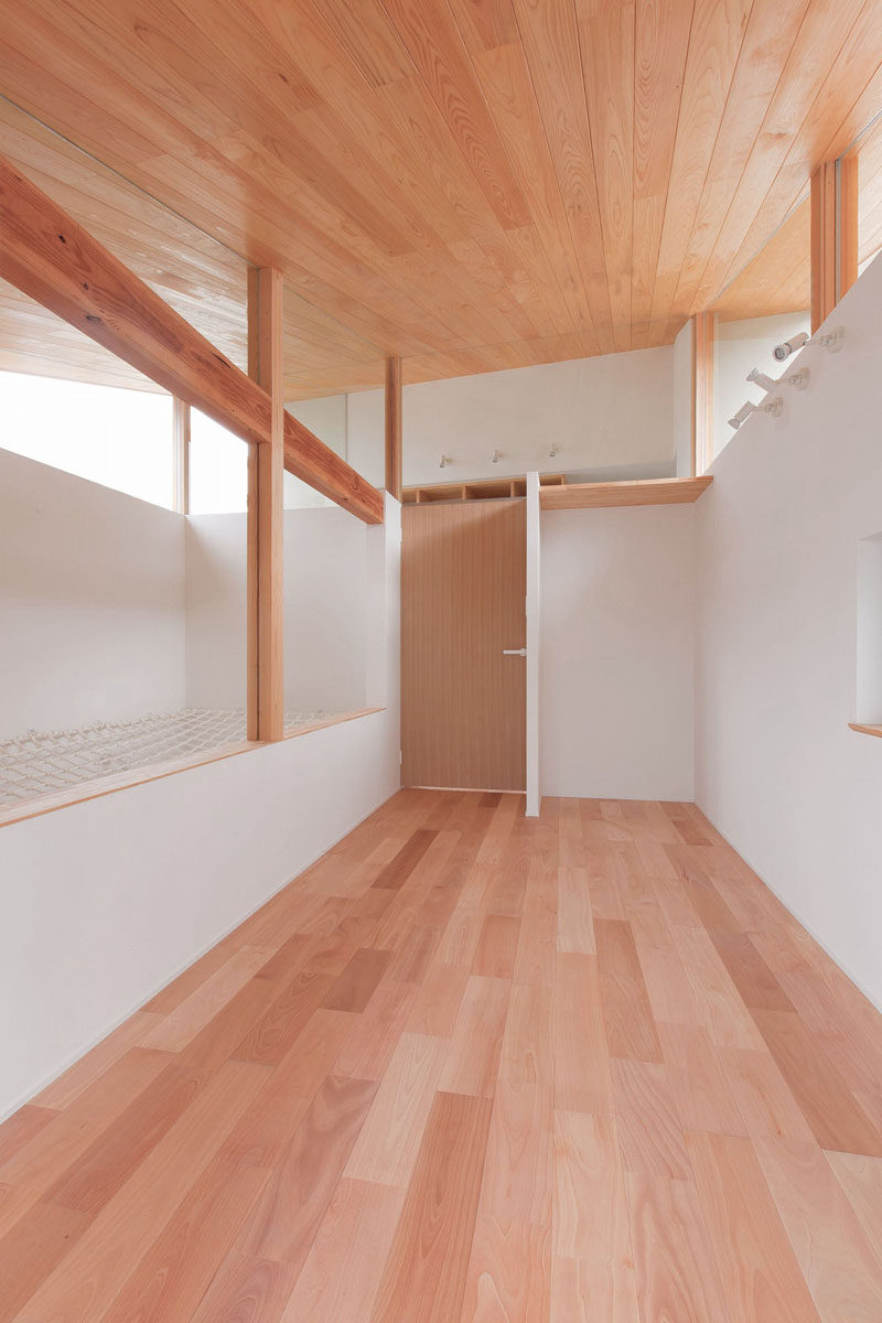 This house in Japan has a built-in, lofted hang-out net for the children to relax in.