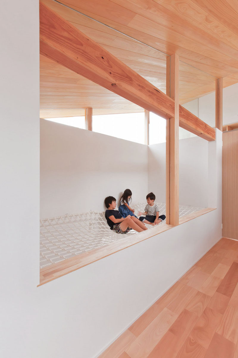 This house in Japan has a built-in, lofted hang-out net for the children to relax in.