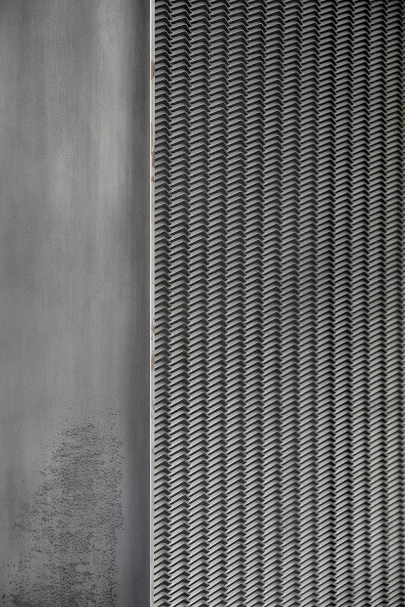 This metal screen is part of a 'cube' storage unit in an industrial apartment in London.