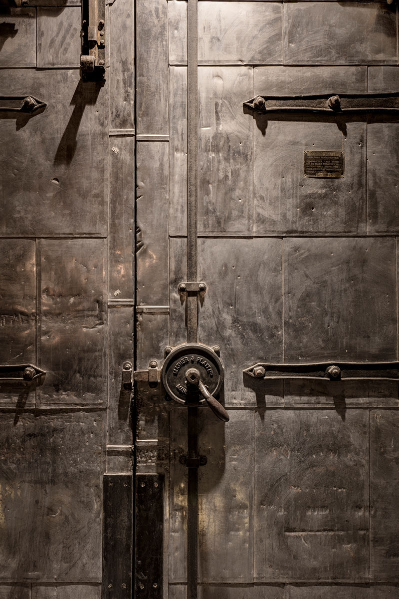 This large metal door is a feature in an industrial apartment in London.