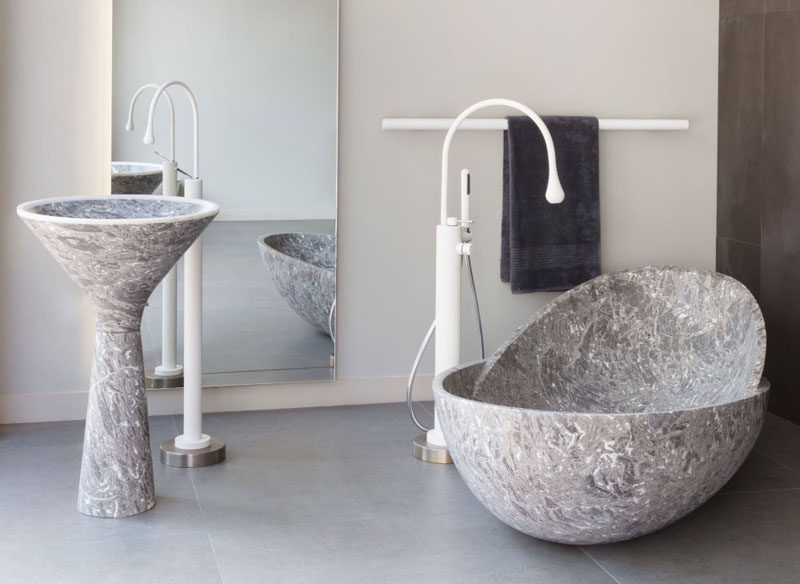 Bathroom Design Idea - 5 Ideas For Adding Marble To Your Bathroom // Bathtubs - Unique in more ways than one, this rounded marble tub gives you the support you need while you unwind in the warm water.