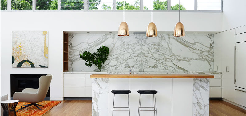 Kitchen Design Idea - How To Add Marble In Your Kitchen // A partially marble island, marble countertops and backsplash along the back wall of this kitchen makes for a clean and modern design.