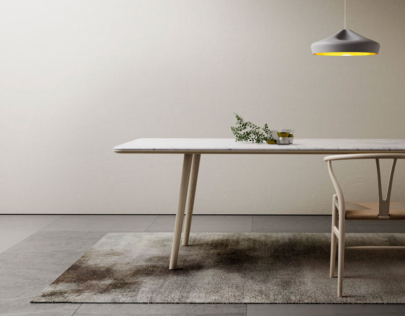 Kitchen Design Idea - How To Add Marble In Your Kitchen // A big long marble table provides an elegant spot to gather around with friends and enjoy tasty food and engaging conversation.