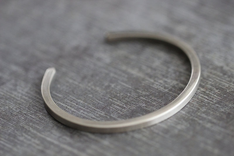 The Ultimate Gift Guide For The Modern Man (40+ Ideas!) // A Thin Minimalist Metal Bracelet