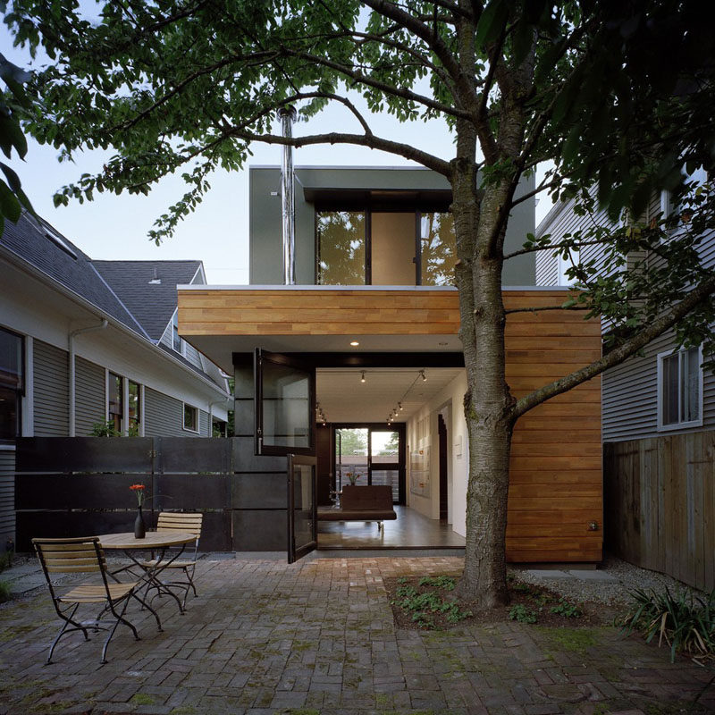 Door Design Ideas - 9 Examples Of Modern Dutch Doors // The doors leading out to the back patio of this home have been divided in half to keep animals and kids inside while still allowing them to see out.