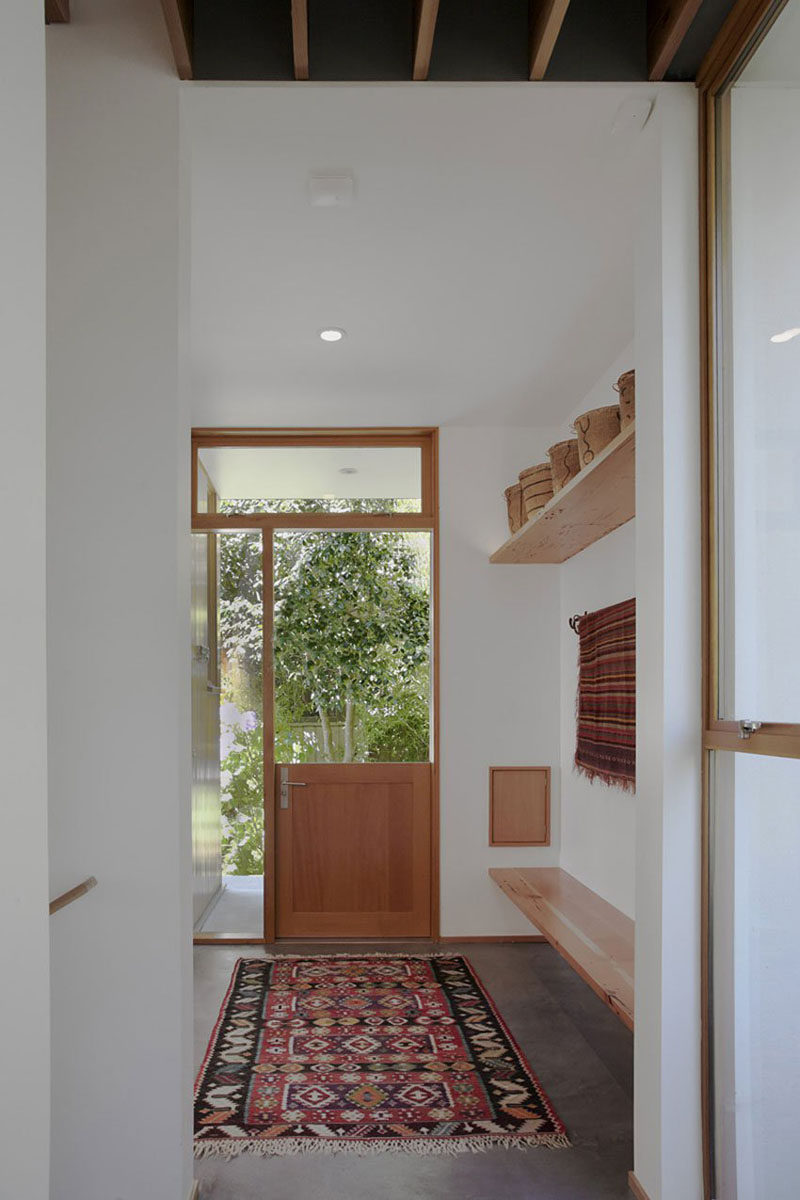 Door Design Ideas - 9 Examples Of Modern Dutch Doors // This modern mud room features a Dutch door that lets in a nice breeze when the top half is left open.