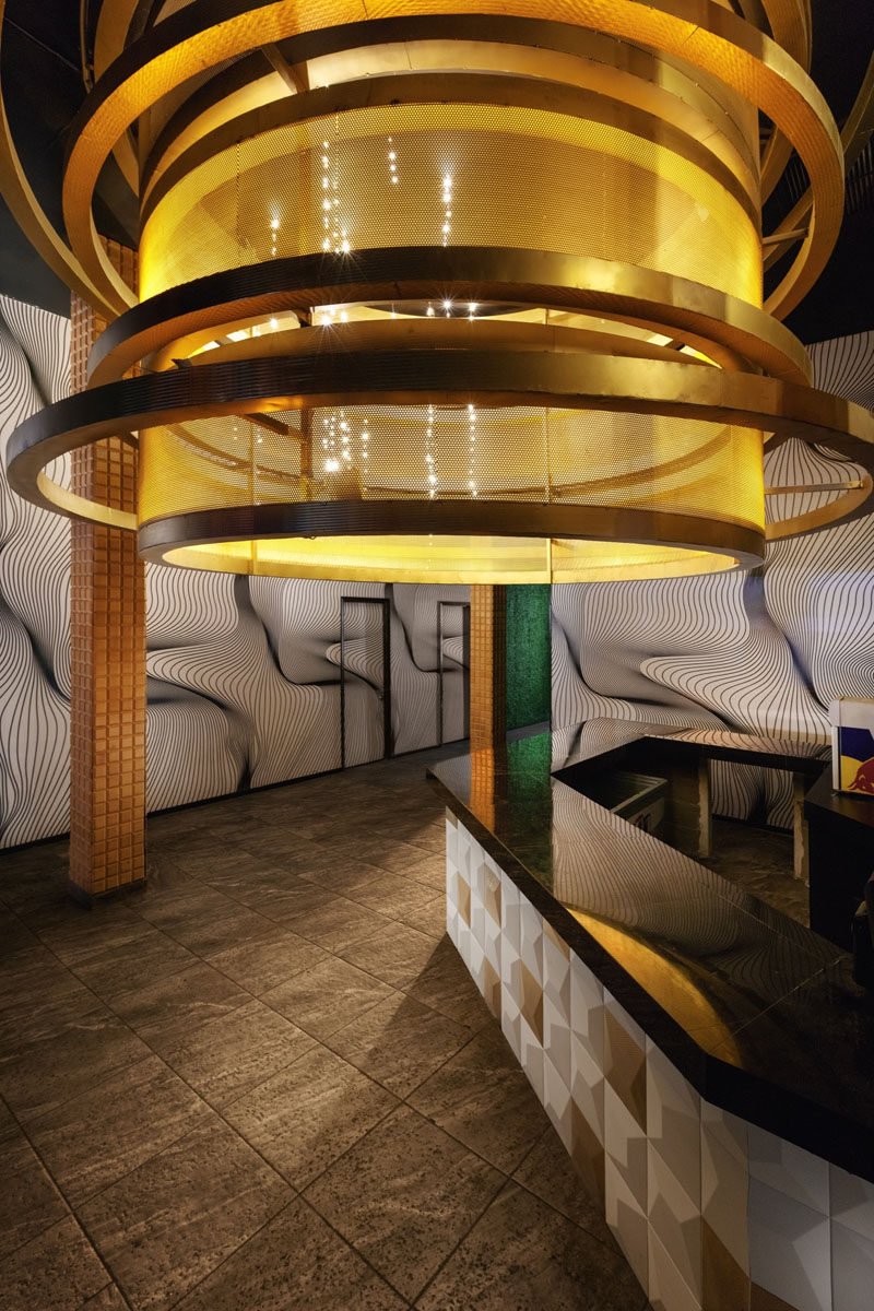 This bar/serving area has a large golden lamp that's almost 10 feet (3m) in diameter.