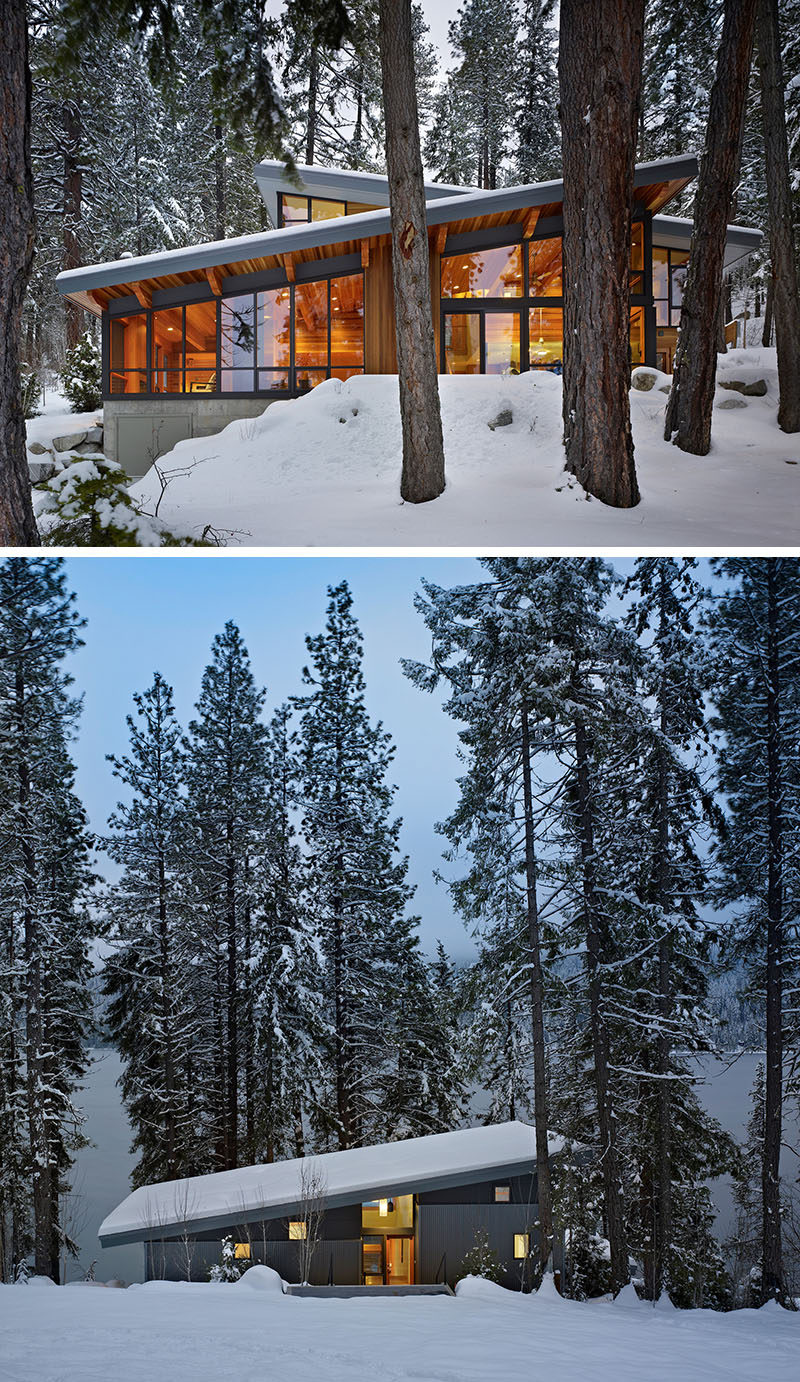 20 Awesome Examples Of Pacific Northwest Architecture // Large windows keep this house feeling connected to the surrounding forest and the rocks surrounding the home provide drainage when the snow melts.