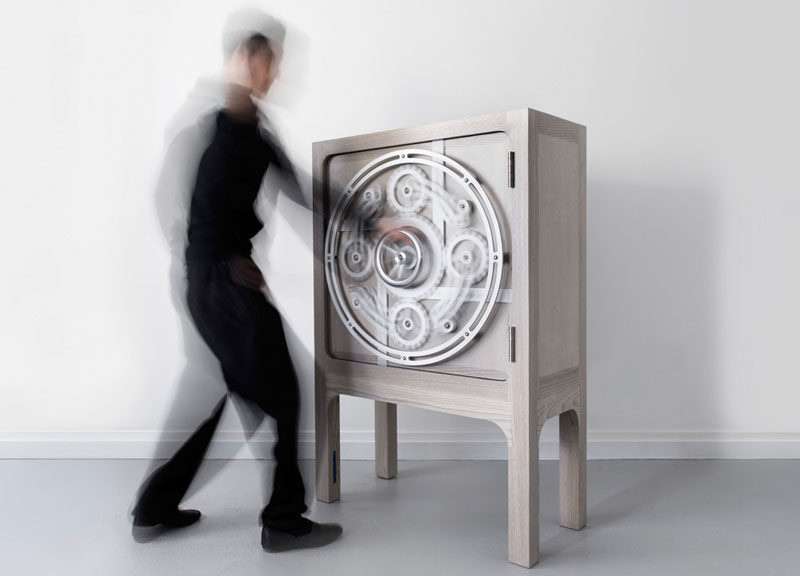 This safe cabinet has a wheel that you turn to open it.