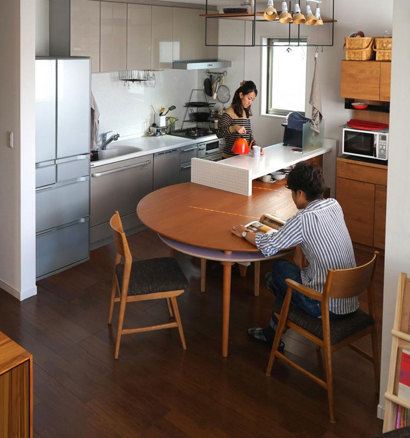 Kitchen Design Ideas - 14 Kitchens That Make The Most Of A Small Space // This small kitchen makes use of all available space, including the ceiling, counters, walls, and space under the cabinets. A custom designed table was also included that could extend when needed, and be tucked away when not in use.