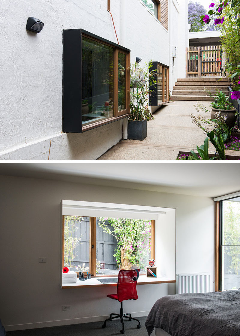 Small Home Office Design Idea - Steel boxes protrude from the bedrooms and create study areas within the rooms.