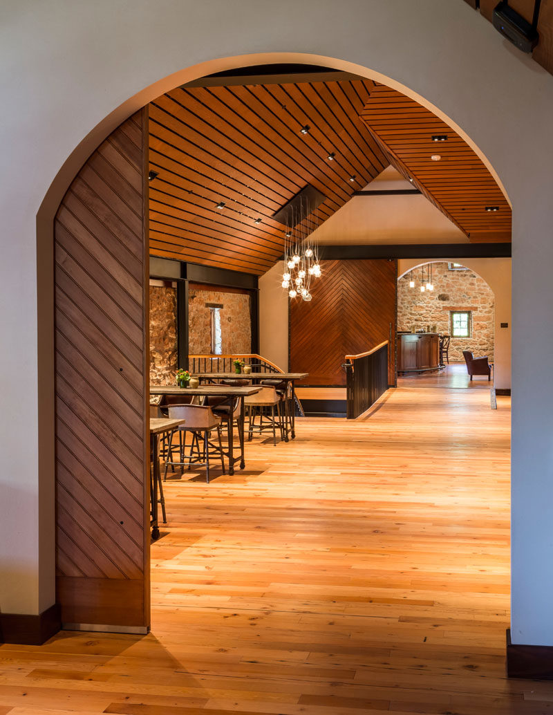 Crisp white walls and wooden ceilings and doors create contrast in the space, and specially designed steel trusses add a touch of drama.