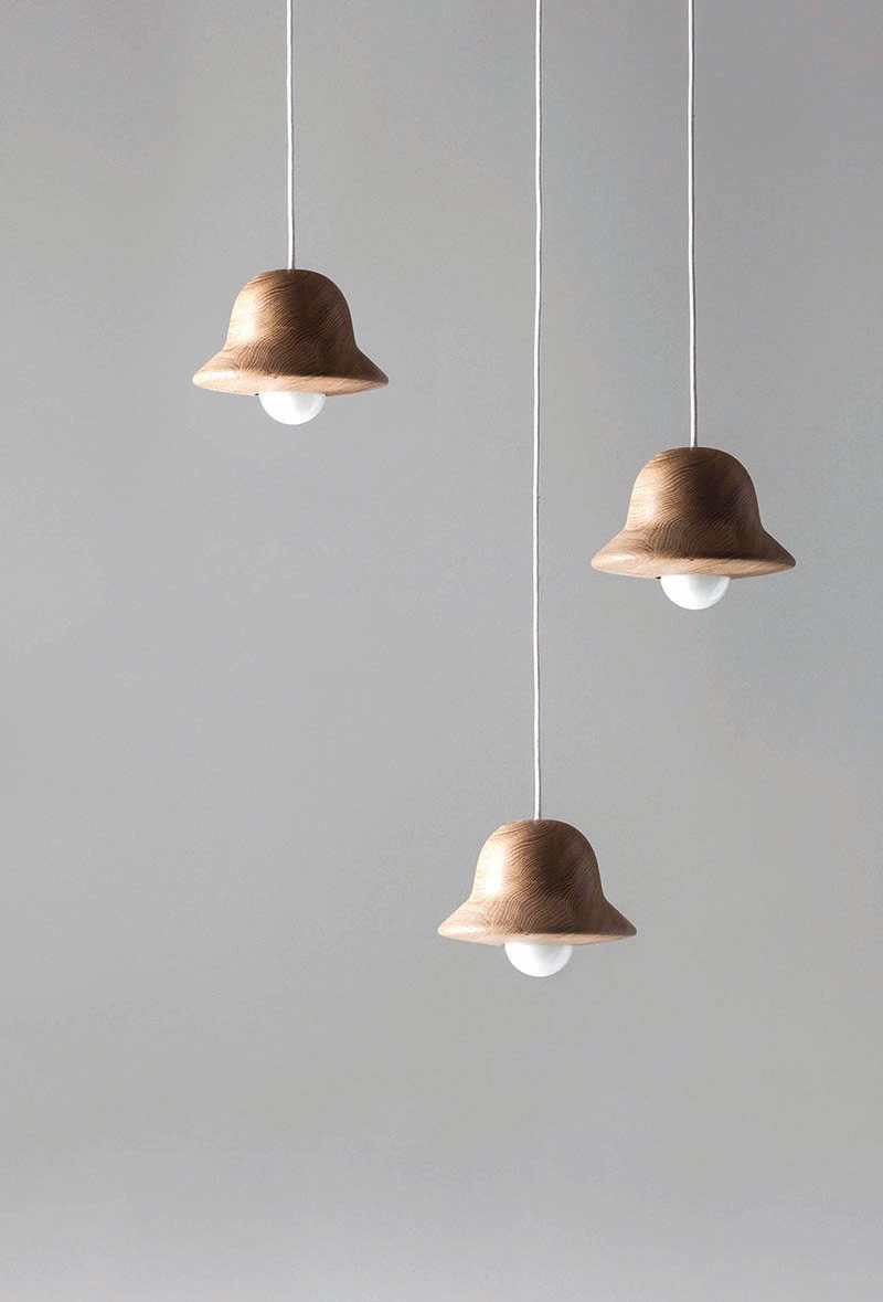 15 Wood Pendant Lights That Add A Natural Touch To Your Decor // These cute wood pendant lights were modeled after the hat blocks that milliners use to make hats.