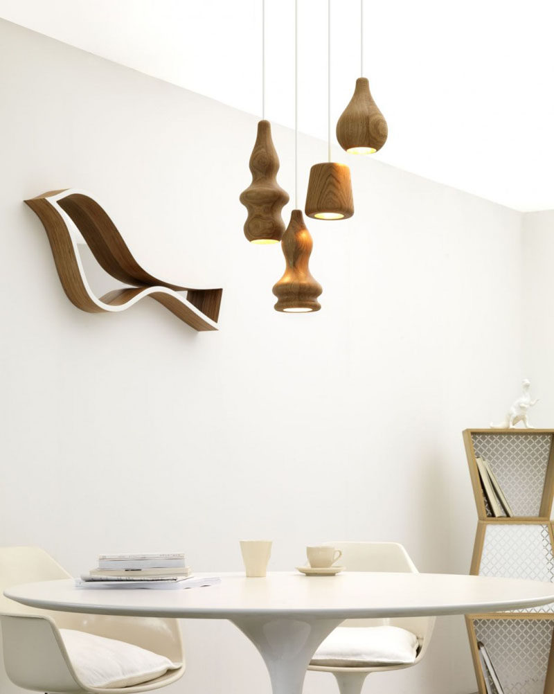 15 Wood Pendant Lights That Add A Natural Touch To Your Decor // Smooth light colored wood has been used to create these pendant lights in bulbous shapes.