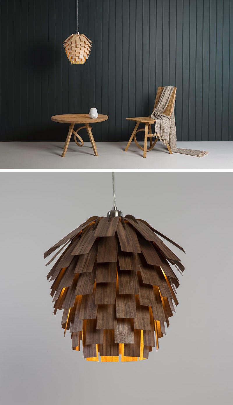 15 Wood Pendant Lights That Add A Natural Touch To Your Decor // Wood veneer strips are layered on top of each other to create a pendant light that looks like a pine cone.