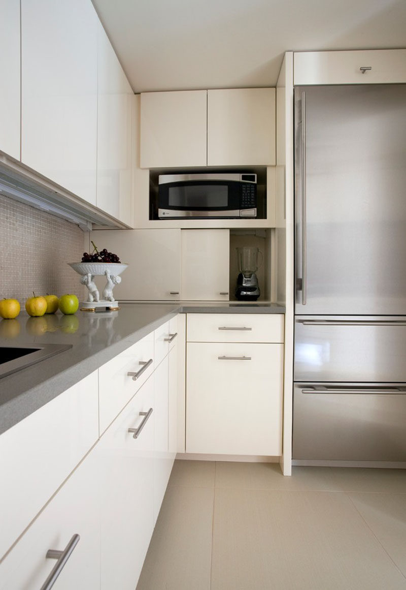 Kitchen Design Idea - Store Your Kitchen Appliances In A Dedicated Appliance Garage // The sliding doors of this appliance garage open to reveal a spacious hiding spot just the right size for the most frequently used appliances.  #ApplianceGarage #KitchenIdeas #KitchenDesign