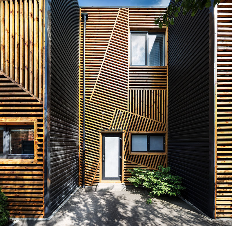 When Pominchuk Architects were designing these townhouses in Kharkiv, Ukraine, they decided to use wooden strips arranged in a geometric design to create a unique facade.