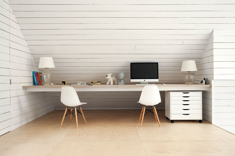 This cabin has a built-in desk tucked away into a loft area.