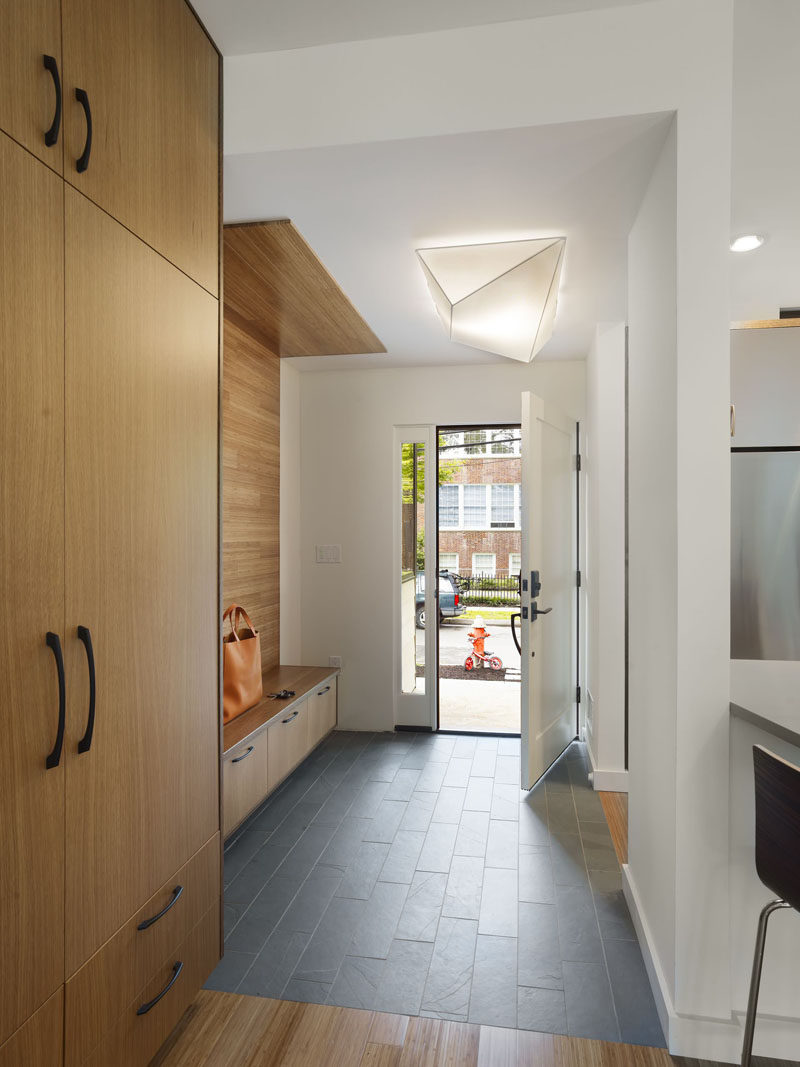 Entryway Design Ideas - 3 Different Styles Of Entryway Benches // The bench in this entryway is built right into the storage unit making the whole space look cohesive and organized.