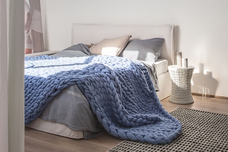 Bedroom Design Idea - 7 Ways To Create A Warm And Cozy Bedroom // Chunky blankets draped over the end of your bed or hanging on the back of a chair in your room also add a huge amount of texture and warmth to your space both figuratively and literally.