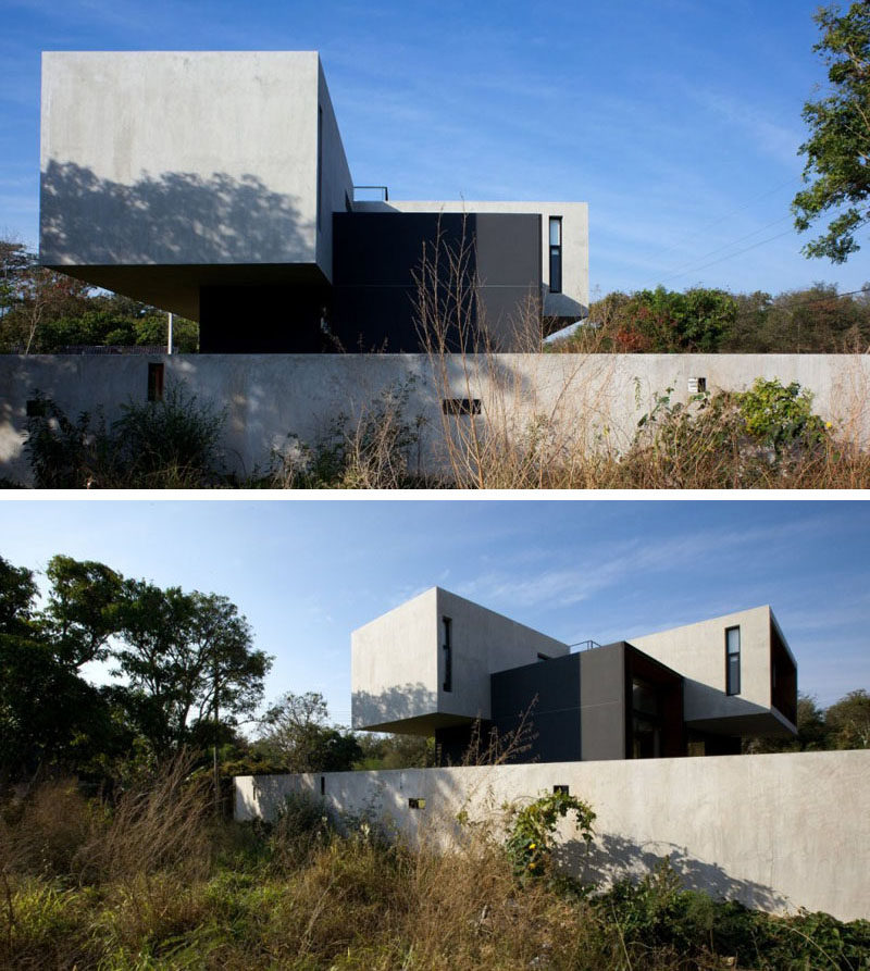 This concrete home in Thailand has an upper floor that's cantilevered.