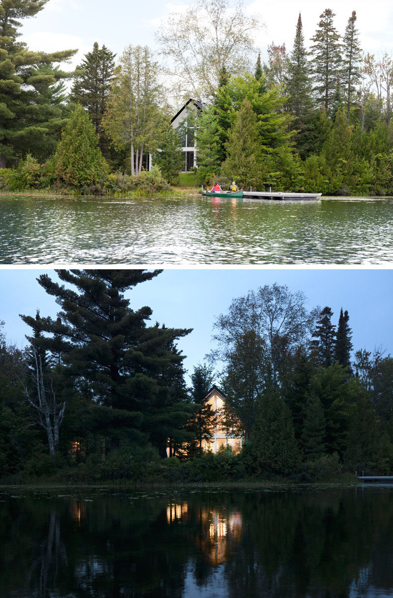 Hidden behind the trees, Chalet de la Plage has been designed to face the lake and large windows show off the light at night.