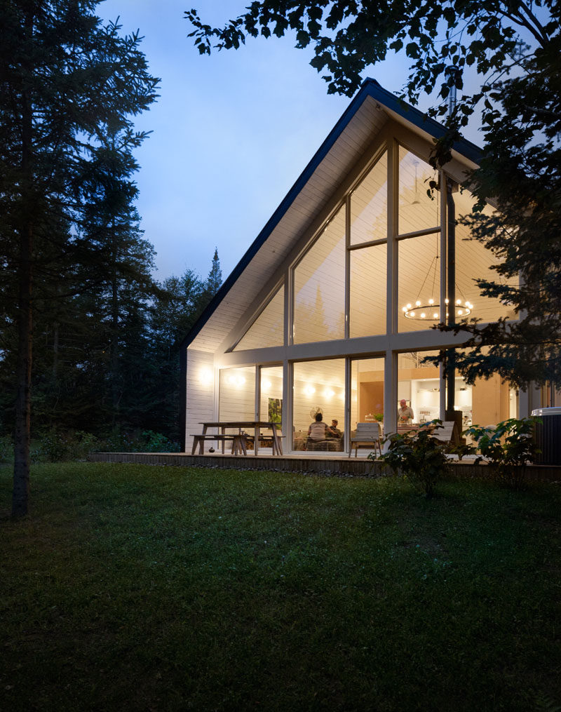 Large windows are set back from the shell of the building to create an overhang.