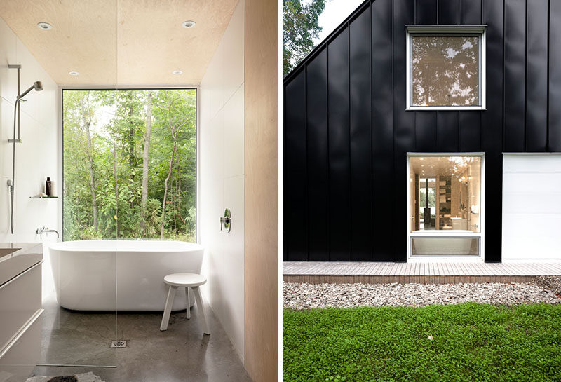 In this bathroom, a large window directly in front of the bath allows for an uninterrupted view of the outdoors.