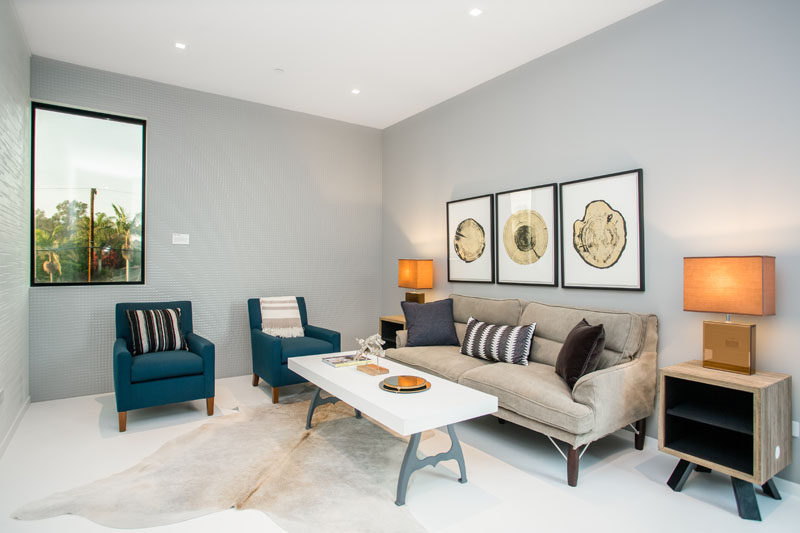 This sitting room with gray walls is a quiet and calm space to retreat to when you need to relax.