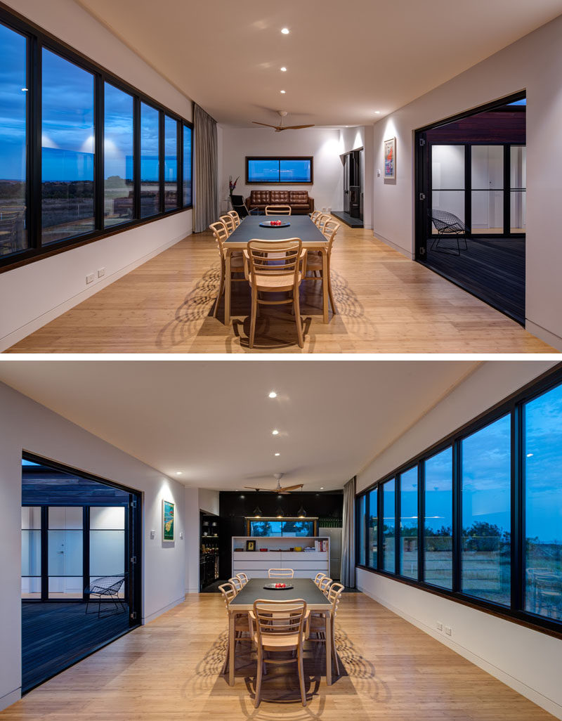 This dining area has direct access to the home's courtyard, and a wall of windows provides plenty of daylight into the home.