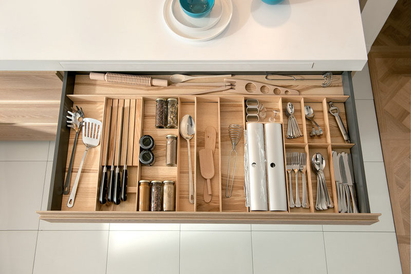 Kitchen Drawer Organization - Design Your Drawers So Everything Has A Place // This wide drawer holds all of the essentials, including daily cutlery, frequently used utensils and favorite spices, to make cooking and food prep that much easier.