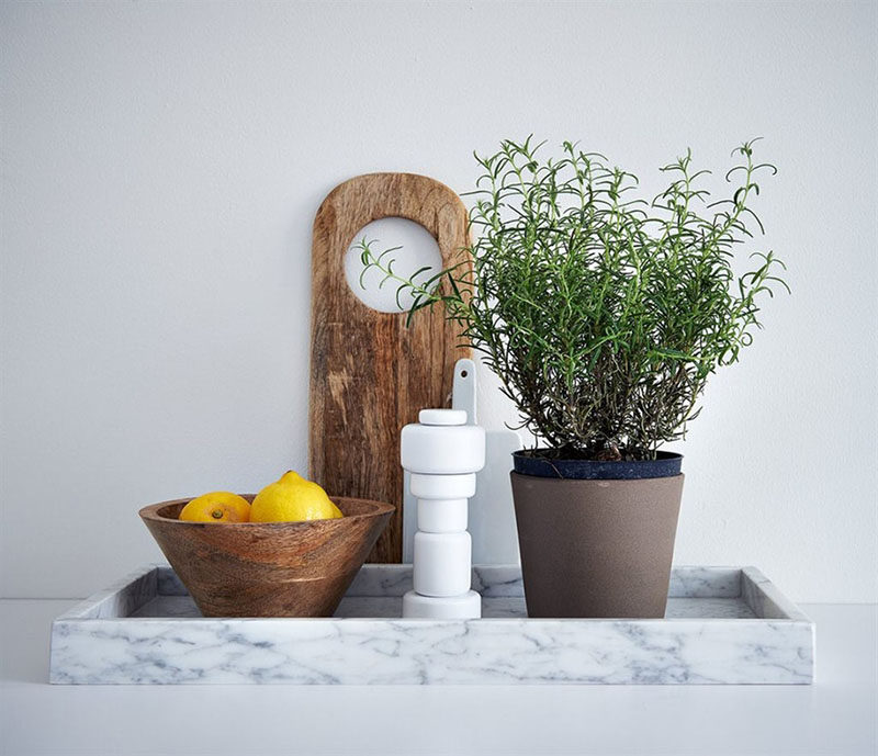 Home Decor Ideas - 6 Ways To Use Serving Trays In Your Decor // In the kitchen, decorated with a fruit bowl, herbs and salt'n'pepper shakers.