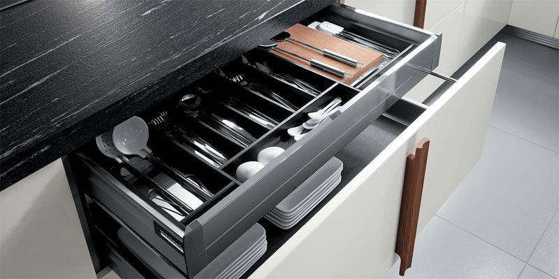 Kitchen Drawer Organization - Design Your Drawers So Everything Has A Place // Cutlery and other frequently used utensils sit in this organized top drawer and are easy to grab when you need them.