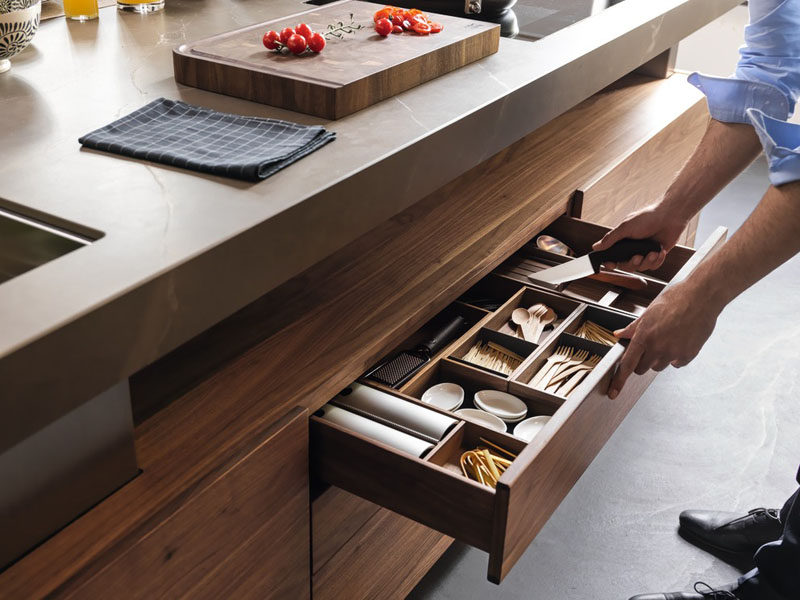 Kitchen Drawer Organization - Design Your Drawers So Everything Has A Place // The knives in this drawer are tucked into the protectors and rest on an elevated piece of wood to create a gap that makes picking them up much easier.