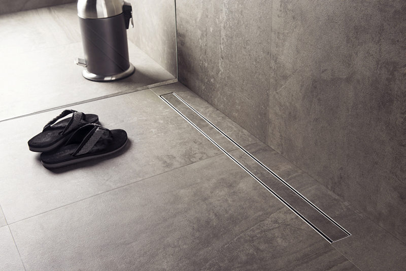 Bathroom Design Idea - Include A Linear Shower Drain // Linear shower drains, also known as infinity shower drains, are drain systems that lie flush with the floor and almost seem to disappear completely. #LinearShowerDrain #InvisibleShowerDrain #BathroomDesign #ShowerDesign #ShowerDrain