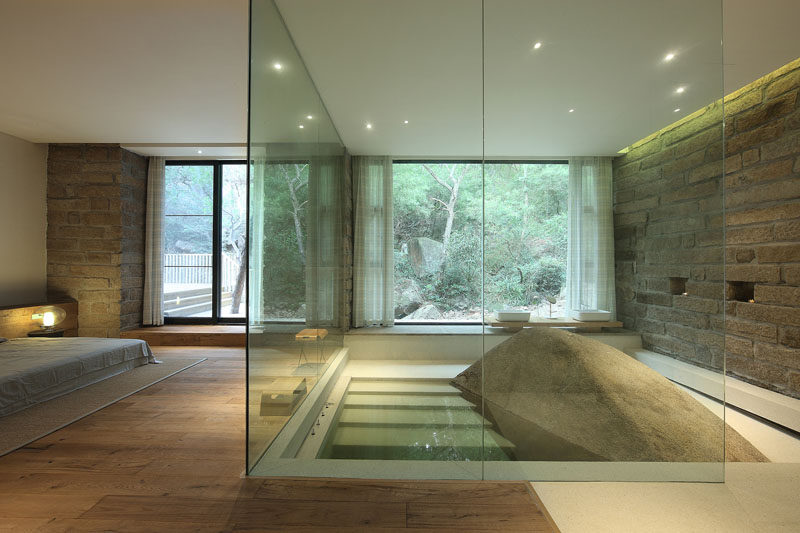 This master bath was build around a naturally occurring boulder.