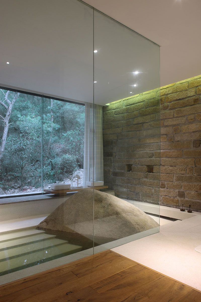 This master bath was build around a naturally occurring boulder.