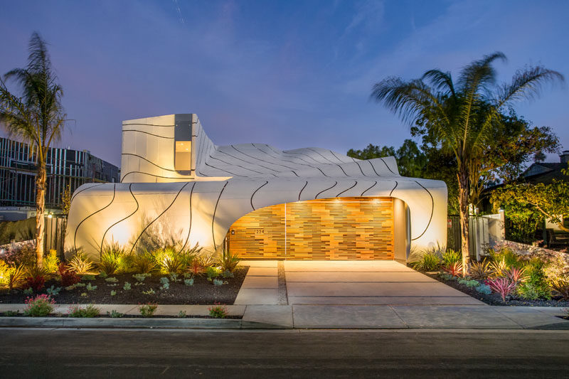 Designer, builder and artist Mario Romano, has completed 'The Wave House', a home in Venice, California, that features a cascading white aluminum skin.