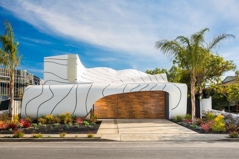 Designer, builder and artist Mario Romano, has completed 'The Wave House', a home in Venice, California, that features a cascading white aluminum skin.