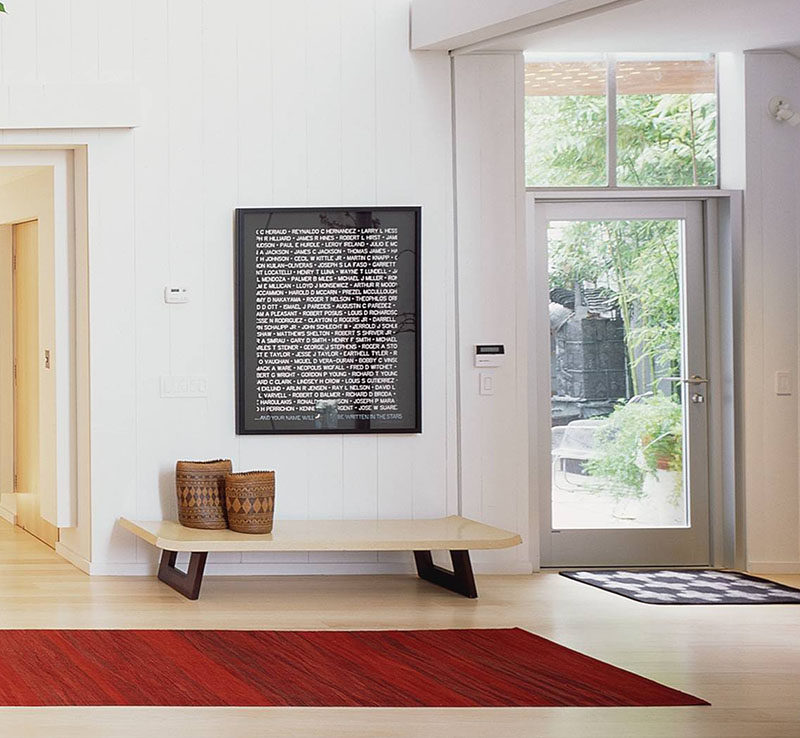 Entryway Design Ideas - 3 Different Styles Of Entryway Benches // The light wood of this bench matches the rest of the interior and is large enough to pile up a few coats or bags when guests come over.