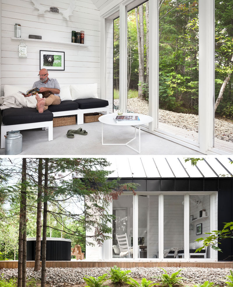 This cabin in the woods has a quiet reading room with views of the trees.