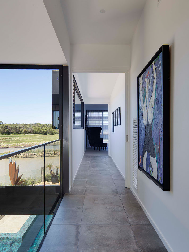 This tiled hallway overlooks the living area below.