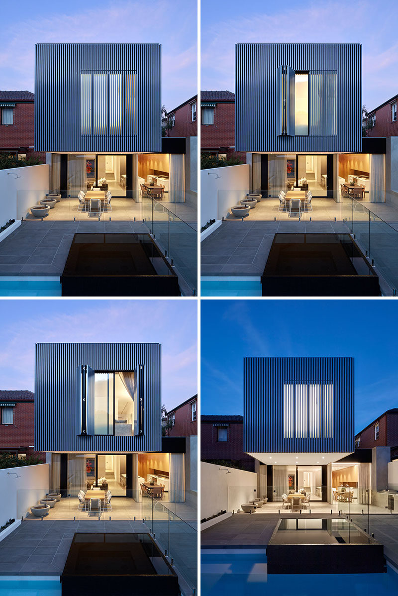 At the rear of this historic home, a new extension is very visible, with a large cantilevered box extending out over the backyard patio. Large folding shutters cover the windows in the extension adding privacy and security.