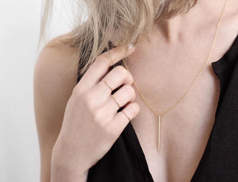 The Ultimate Gift Guide For The Modern Woman (40 Ideas!) // A super delicate silver pendant adds a touch of style to any outfit. #Jewelry #ModernNecklace #MinimalistNecklace #BarNecklace