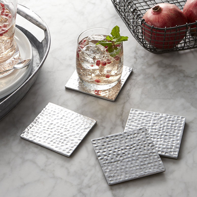 15 Host(ess) Gifts To Make You The Favorite Guest // Coasters are a practical gift that adds more functionality to the host's home. That fancy wood table can now be covered in stylish coasters and protected from the condensation dripping down champagne flutes and cocktail glasses.